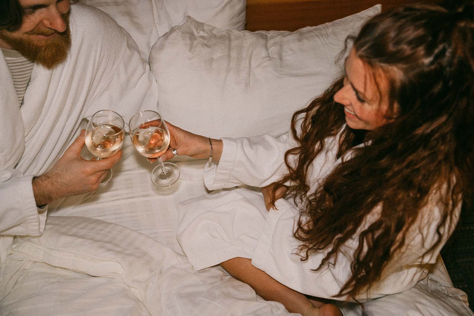 Couple drinking wine in bed in White Salmon