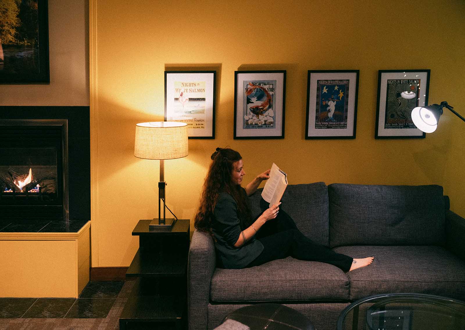 Woman reading in the great room.