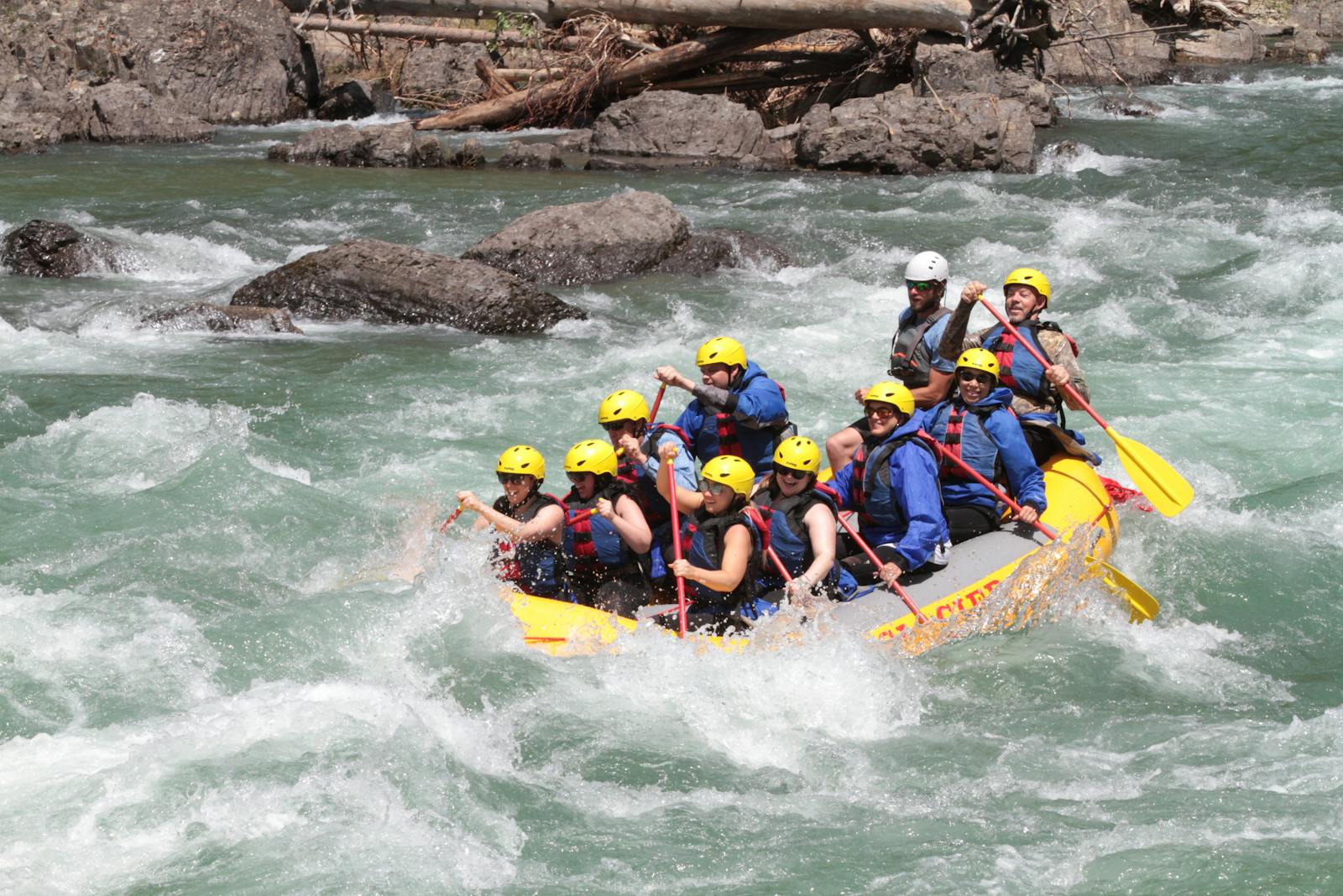 group-in-river-raft River rafters in yellow raft