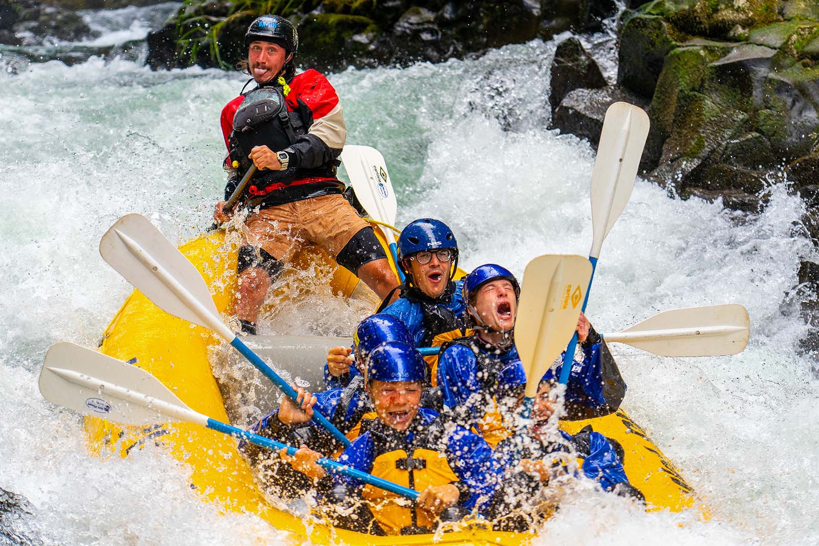 river rafters in yellow raft, white water