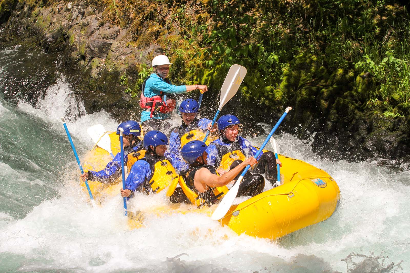 wet-planet-wet-rafters river rafters in yellow raft white water